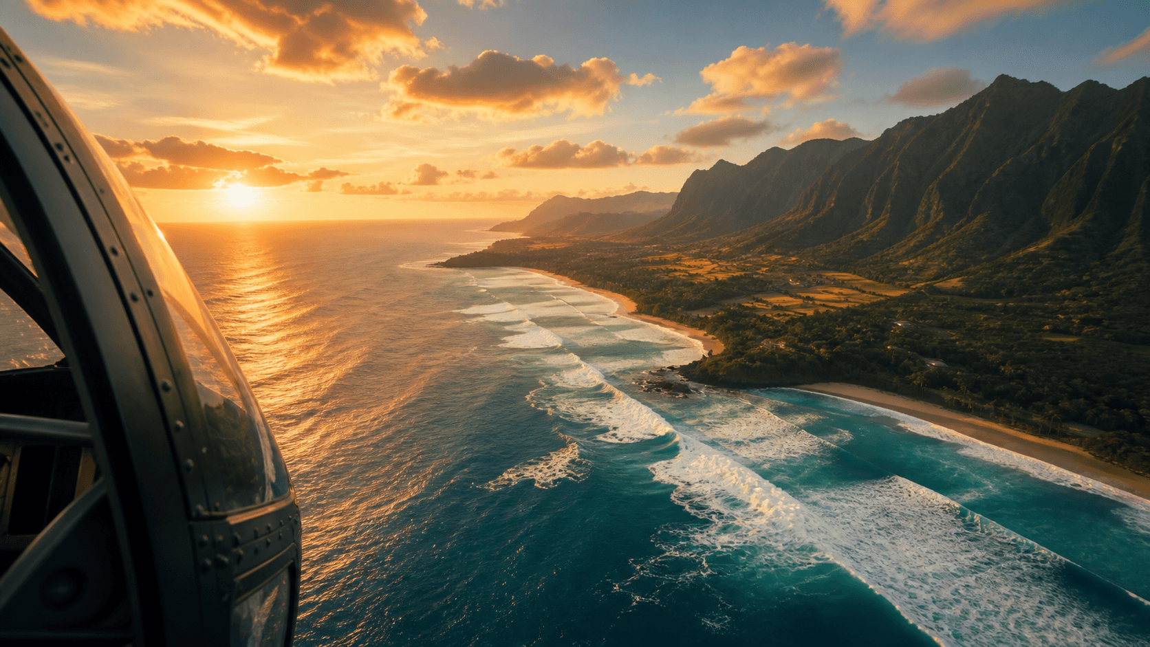 Private helicopter aerial view of Oahu North Shore coastline at sunset