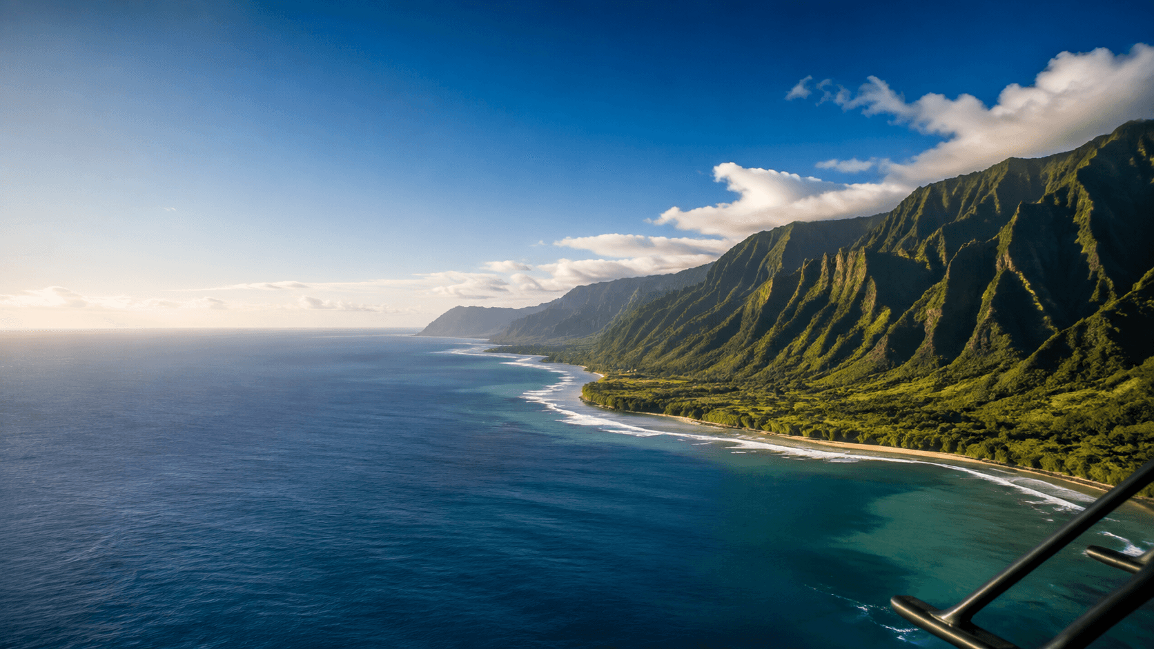 Private helicopter aerial view of the Oahu coastline and Koʻolau Mountains